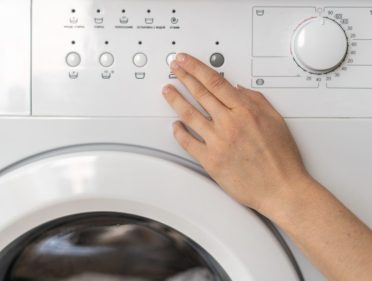 Modern washing machine equipment stands at home