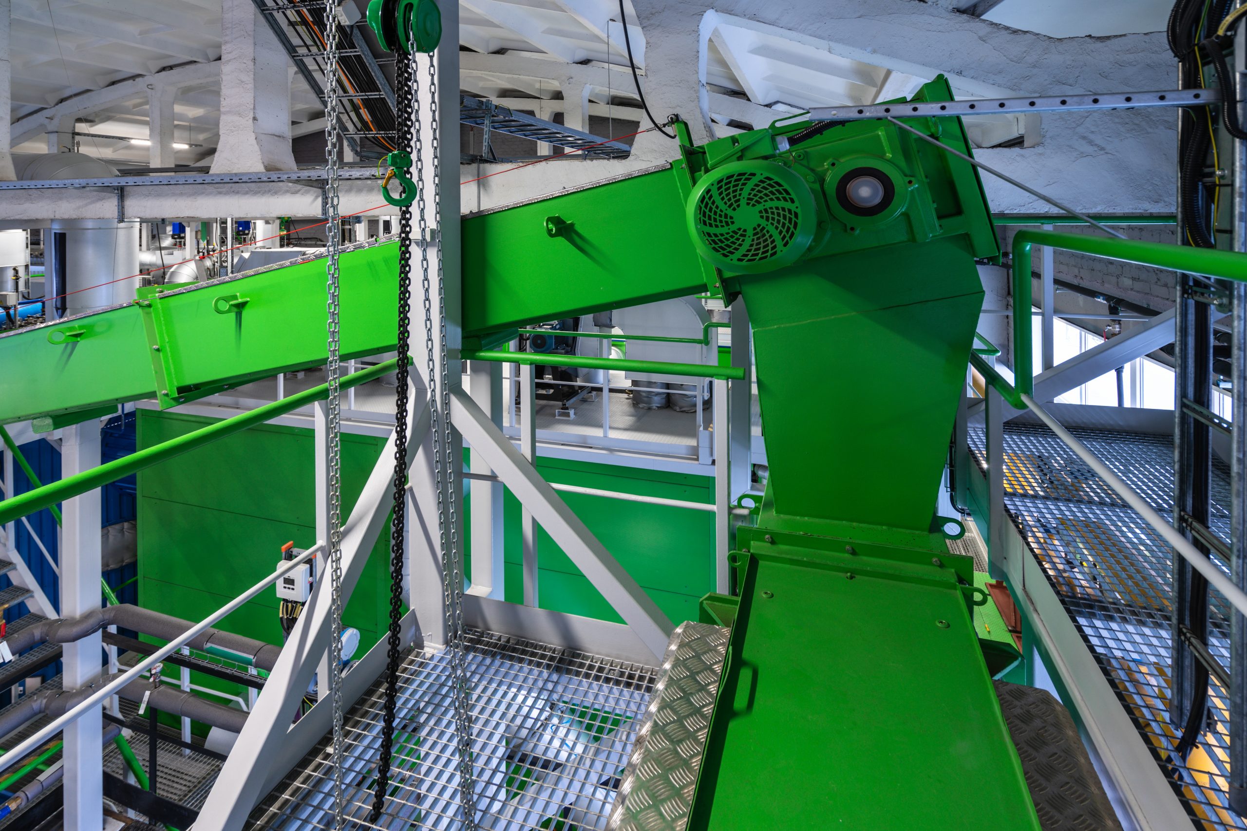 Biofuel boiler house. Wood chip chain conveyor