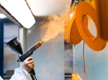 Powder-Coating-Orange-parts-worker