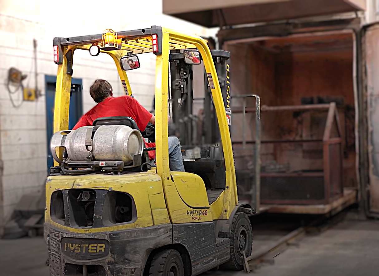 Staff-Man-driving-forklift Staff-Man-driving-forklift